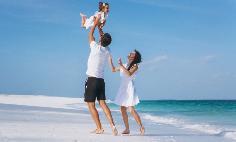 young-family-with-little-daugher-vacation-by-ocean